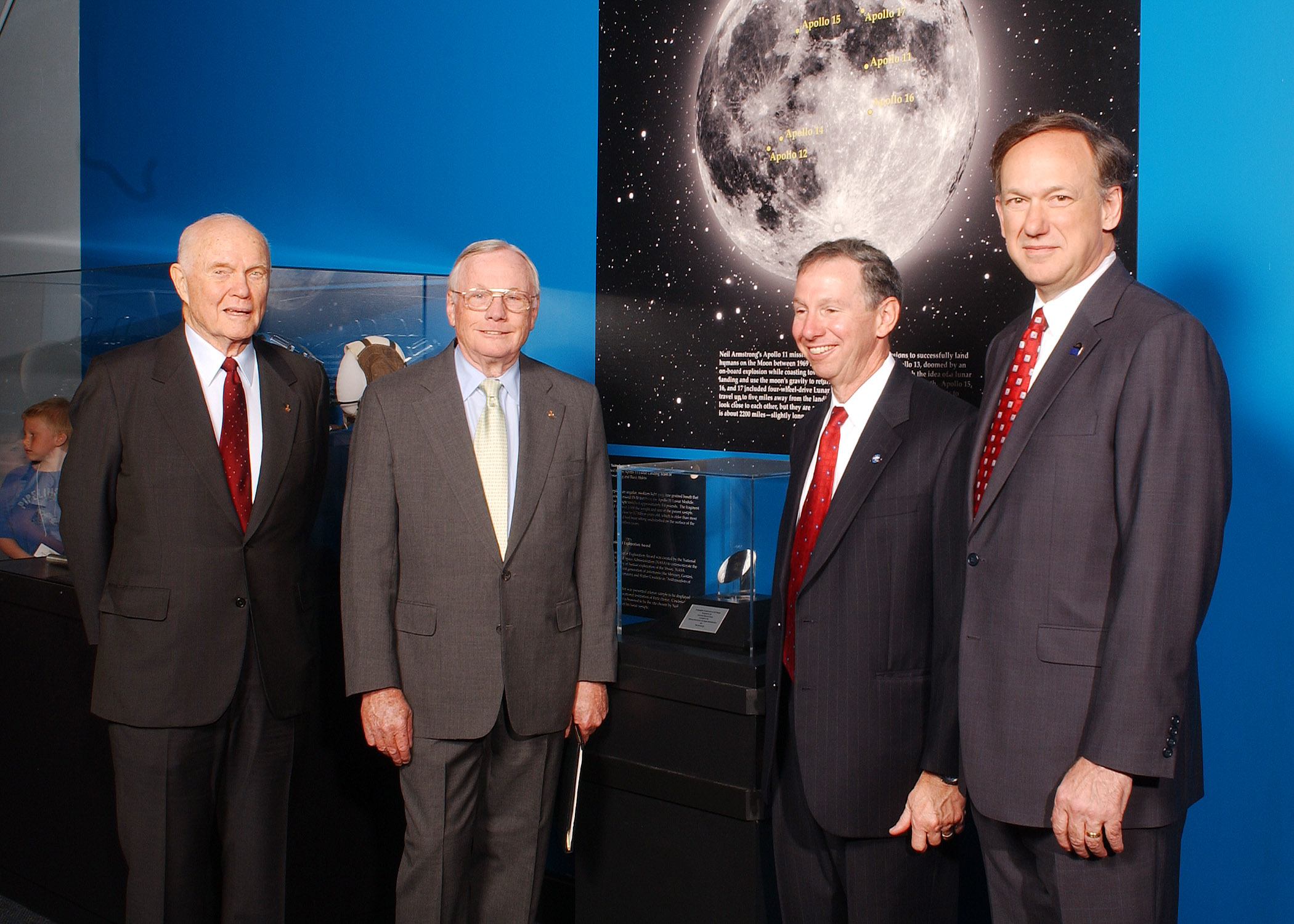 astronauts in front of space rock