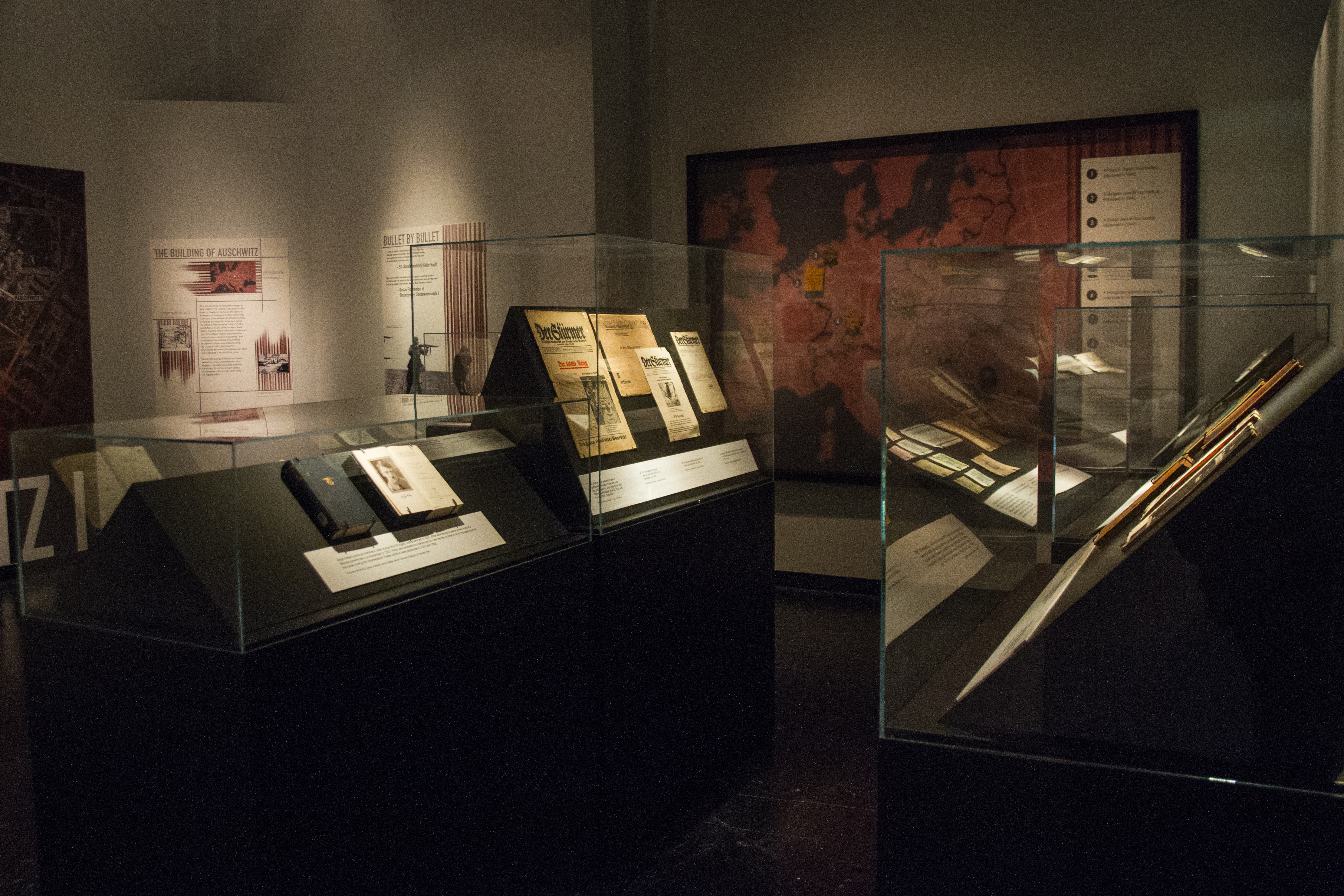 preservation photo of old documents and photographs in an exhibit at cmc