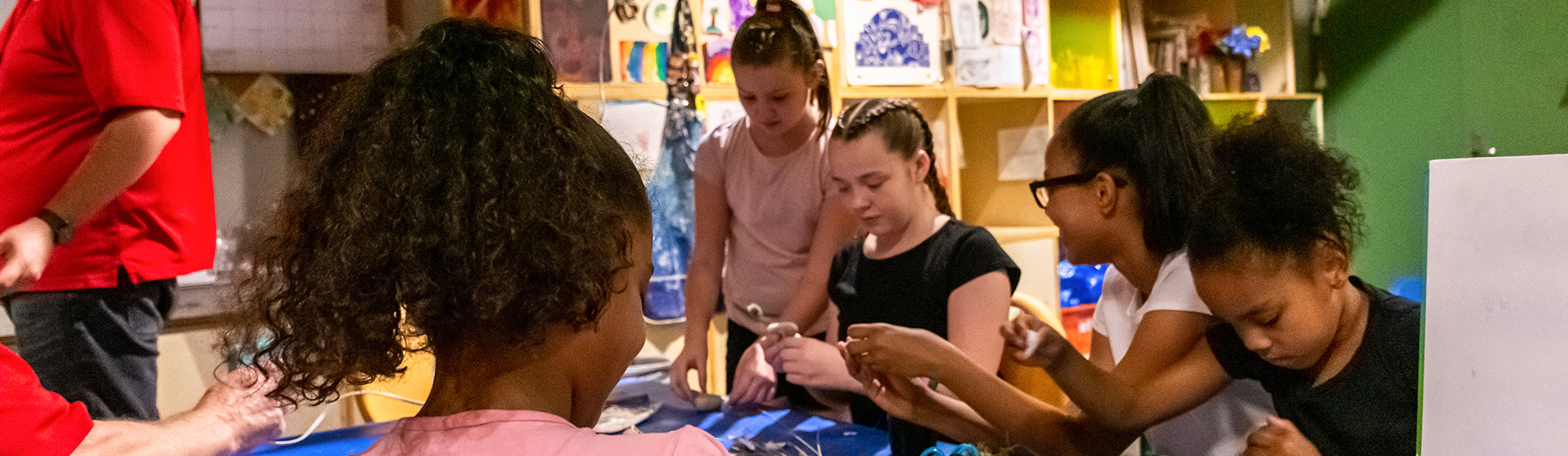 image of children creating artwork and crafts in KidSPACE