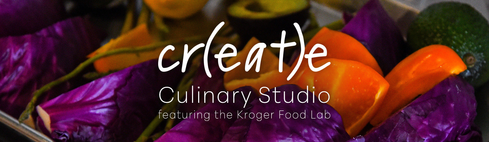 Cr(EAT)e Culinary Studio featuring the Kroger Food Lab. Image of an assortment of vegetables featuring orange peppers, avocado, asparagus, and purple cabbage