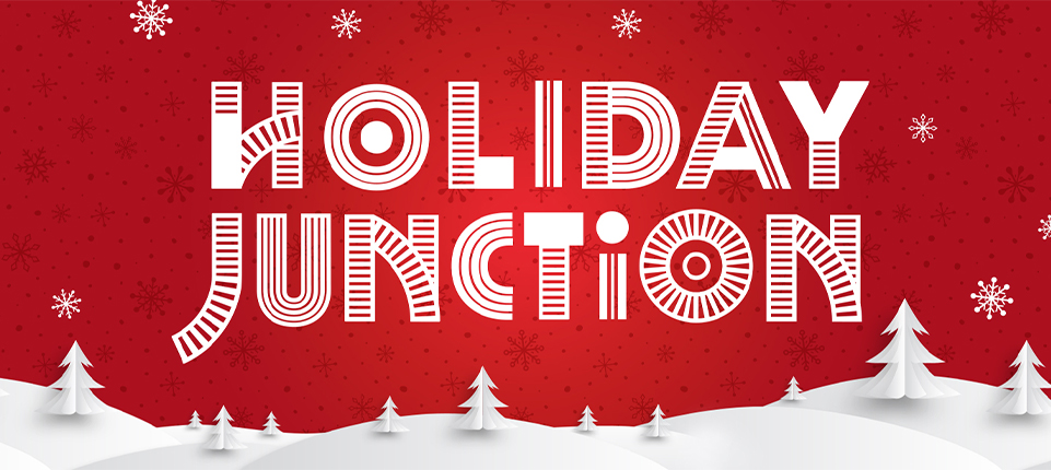 Image of key art for Holiday Junction featuring a red background with white snow and pine trees on snow covered hills.